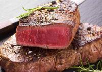 a piece of meat sitting on top of a steak at Hotel-Restaurant Das Grambacher I FREE PARKING I SELF CHECK-IN in Graz