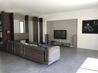 a living room with a couch and a flat screen tv at Villa Alberes Sorede 7 km of beaches in Sorède