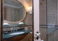 a bathroom with a sink and a mirror at The Pucic Palace in Dubrovnik
