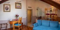 a living room with a blue couch and a table at The Pucic Palace in Dubrovnik