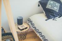 Łóżko lub łóżka w pokoju w obiekcie Villa Nina- Maison cocon cosy