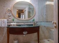 a bathroom with a sink and a mirror at The Pucic Palace in Dubrovnik