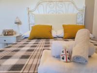 A bed or beds in a room at Spazioso appartamento con terrazza a due passi dal centro