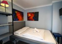 a bed in a room with two pillows on it at Astor Hyde Park Hostel in London