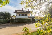 a house with a driveway in front of it at Apartments with a parking space Karigador, Novigrad - 2534 in Karigador