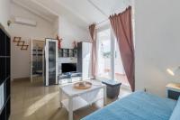a room with a bed and a table and a television at Apartments with a parking space Karigador, Novigrad - 2534 in Karigador