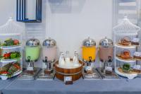 a table with a bunch of different types of food at Panan Krabi Resort in Ao Nang Beach