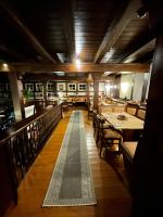 a dining room with tables and chairs in a restaurant at Landhotel &amp; Restaurant Kains Hof in Uhlstädt