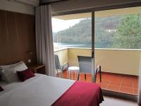 Postel nebo postele na pokoji v ubytování Hotel Eco Salvador