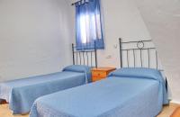 Łóżko lub łóżka w pokoju w obiekcie Apartamento Velarde II