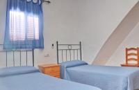 Łóżko lub łóżka w pokoju w obiekcie Apartamento Velarde II