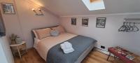 A bed or beds in a room at La Mia Mansardina
