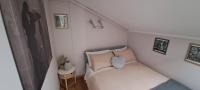 A bed or beds in a room at La Mia Mansardina