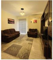 Posezení v ubytování Modern entire apartment in the heart of Sheikh Zayed city