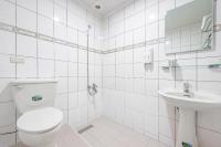 a white bathroom with a toilet and a sink at Jiufen Kite Museum in Jiufen