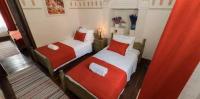 A bed or beds in a room at Zen Alacati Hotel