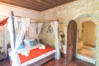 A bed or beds in a room at Zen Alacati Hotel