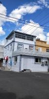 a white building on the side of a street at Home in Hengchun Homestay in Hengchun South Gate