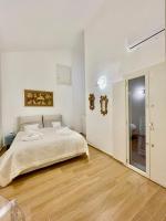 Posteľ alebo postele v izbe v ubytovaní Home Viale Trento 16