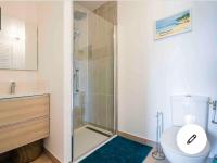 a bathroom with a toilet and a glass shower at Cosy Loire, T2 neuf, front de Loire ,vue cathédrale,5min à pied centre ville et parking privé in Orléans
