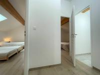a bedroom with white walls and a bed and a door at Chalet Puy-Saint-Pierre, 4 pièces, 8 personnes - FR-1-330C-136 in Puy-Saint-Pierre