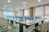 a room with tables and chairs with blue bottles on them at Campanile Lyon Centre - Berges du Rhône in Lyon