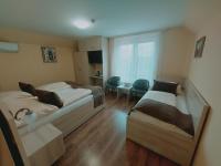 Posteľ alebo postele v izbe v ubytovaní Hotel Panorama