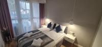 Postel nebo postele na pokoji v ubytování Apartament MAG