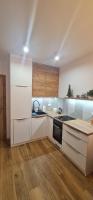 Kuchyň nebo kuchyňský kout v ubytování Apartament MAG