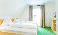 Posteľ alebo postele v izbe v ubytovaní Ferienhaus Kleine Gartenvilla