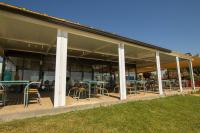 a building with tables and chairs in it at Iate Glória Sem-fim Monsaraz in Monsaraz