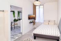 Łóżko lub łóżka w pokoju w obiekcie LD-Location Hôtel