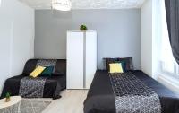 Łóżko lub łóżka w pokoju w obiekcie LD-Location Hôtel