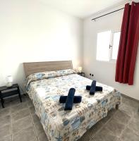 Łóżko lub łóżka w pokoju w obiekcie APARTAMENTO SOL PLAYA