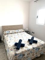 Łóżko lub łóżka w pokoju w obiekcie APARTAMENTO SOL PLAYA