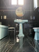 a bathroom with a sink and a tub and a mirror at Place Vendôme Luxe 60 SQM Bail mobilité in Paris
