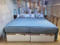 A bed or beds in a room at Apartamento Santa Agueda