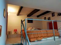 Łóżko lub łóżka w pokoju w obiekcie Casa vacanze Totò&Peppino