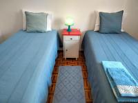 Postel nebo postele na pokoji v ubytování Casa Laranjeira