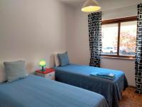 Postel nebo postele na pokoji v ubytování Casa Laranjeira