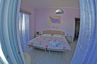 Posteľ alebo postele v izbe v ubytovaní Dimitropoulos Apartments