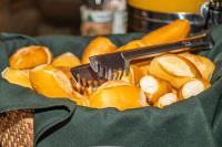 a basket filled with peeled oranges with a spatula at VOA Hotel Caxambu in Caxambu