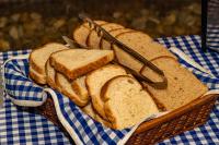 a basket filled with slices of bread on a table at VOA Hotel Caxambu in Caxambu