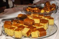 a plate of cakes and other food on a table at VOA Hotel Caxambu in Caxambu