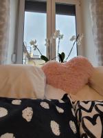 Posteľ alebo postele v izbe v ubytovaní Rosé Apartment