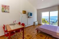 Televízia a/alebo spoločenská miestnosť v ubytovaní Apartments Dream view