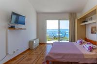 Televízia a/alebo spoločenská miestnosť v ubytovaní Apartments Dream view