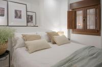 Postel nebo postele na pokoji v ubytování Suites Jardines de la Alhambra