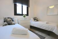 Postel nebo postele na pokoji v ubytování OASIS Malaga City Apartment