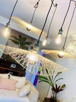 a group of lights hanging from a ceiling at Maison de 3 chambres avec jardin clos et wifi a Saint Denis in Saint-Denis